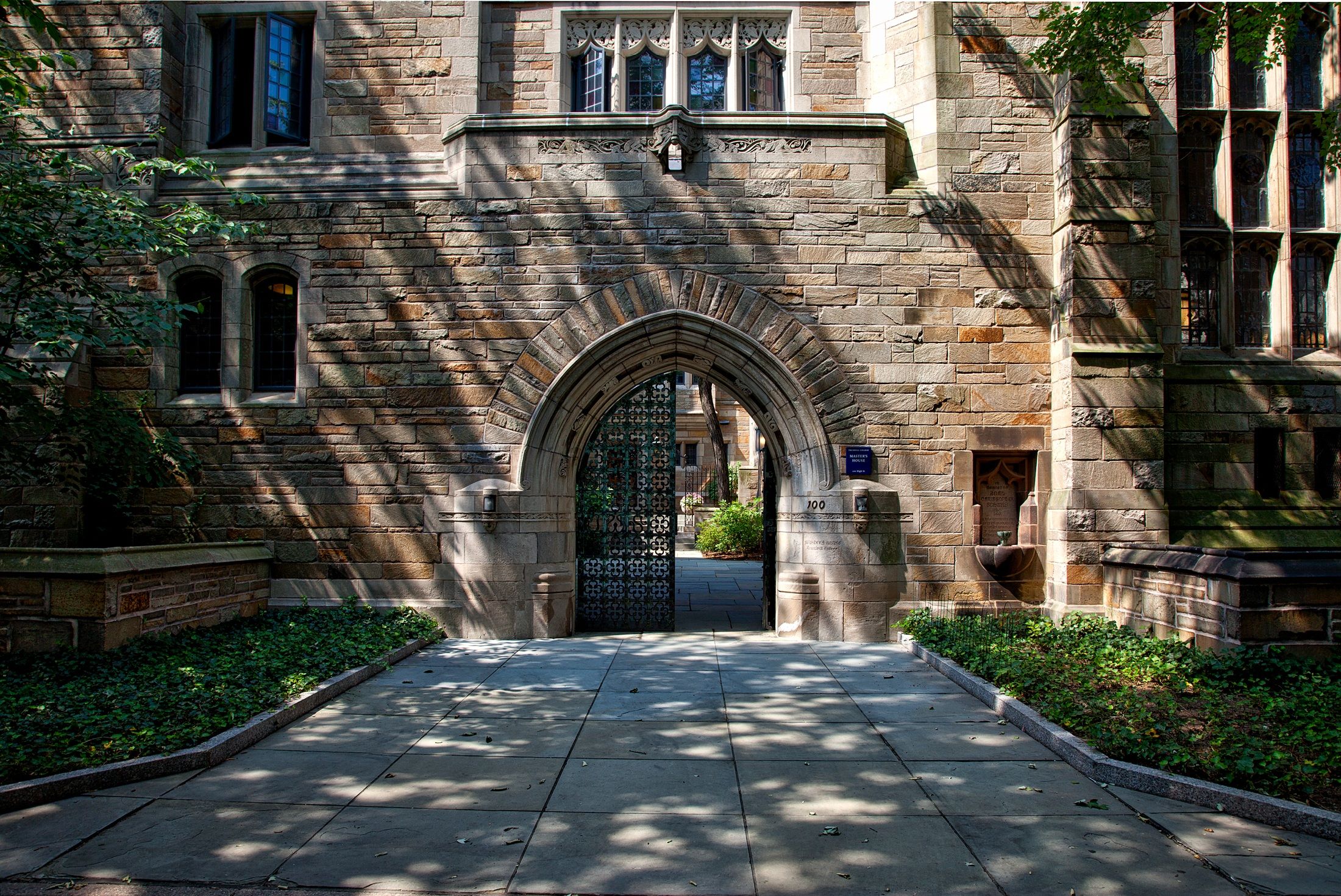 Stone archway leading into a university campus